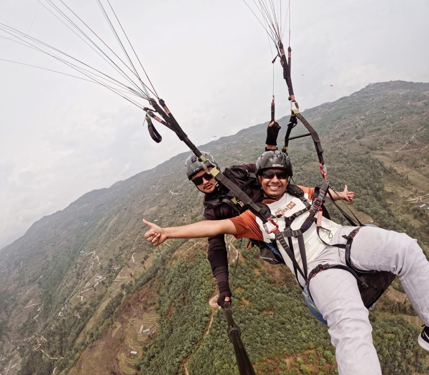 Paragliding over a mountain valley